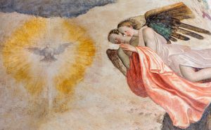 Brescia, Italy - May 21, 2016: Brescia - The fresco of angels adorating of Holy Spirit in church Chiesa del Santissimo Corpo di Cristo by Paolo da Caylina il Vecchio (circa 1501).
