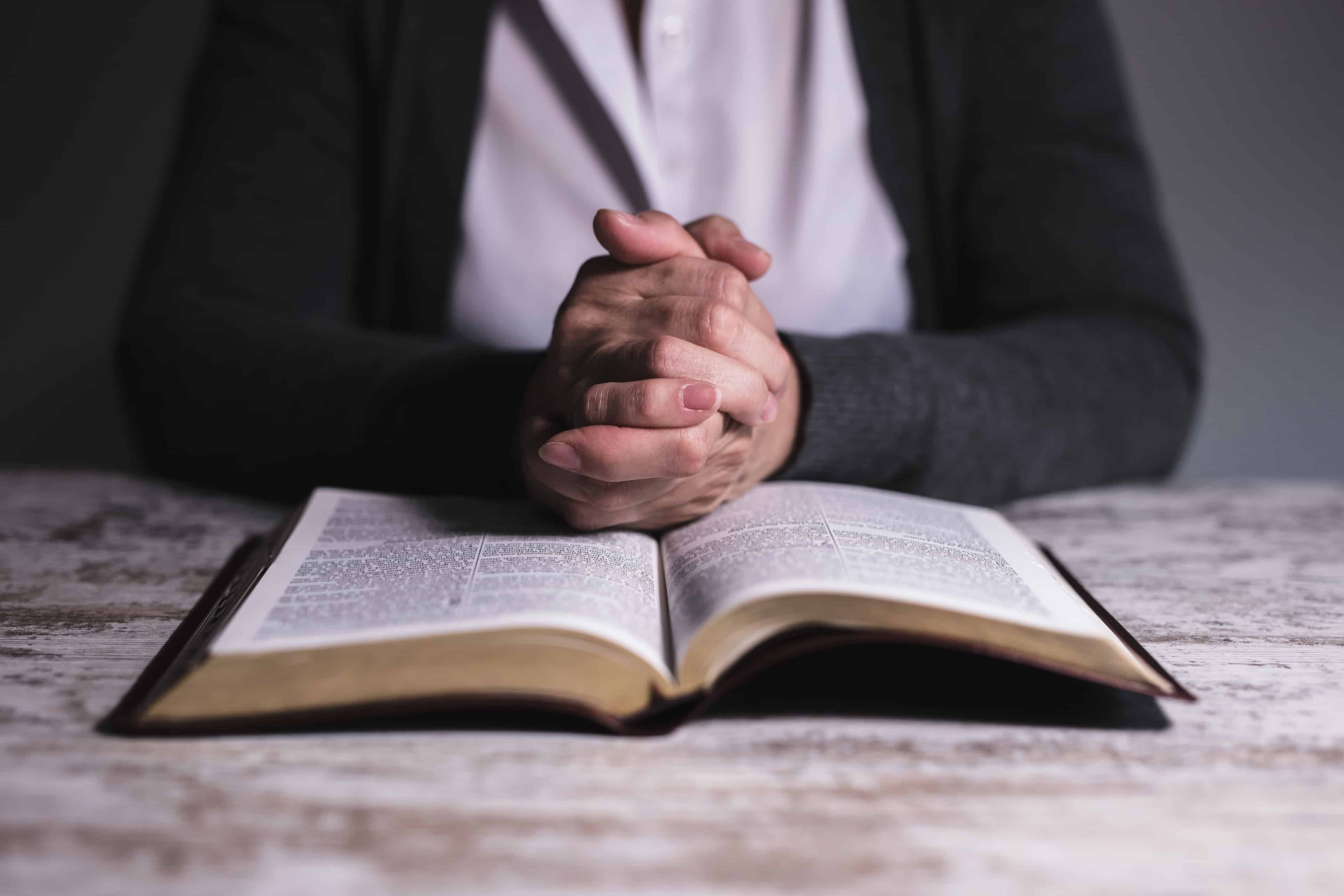 Close up of woman reading holy bible